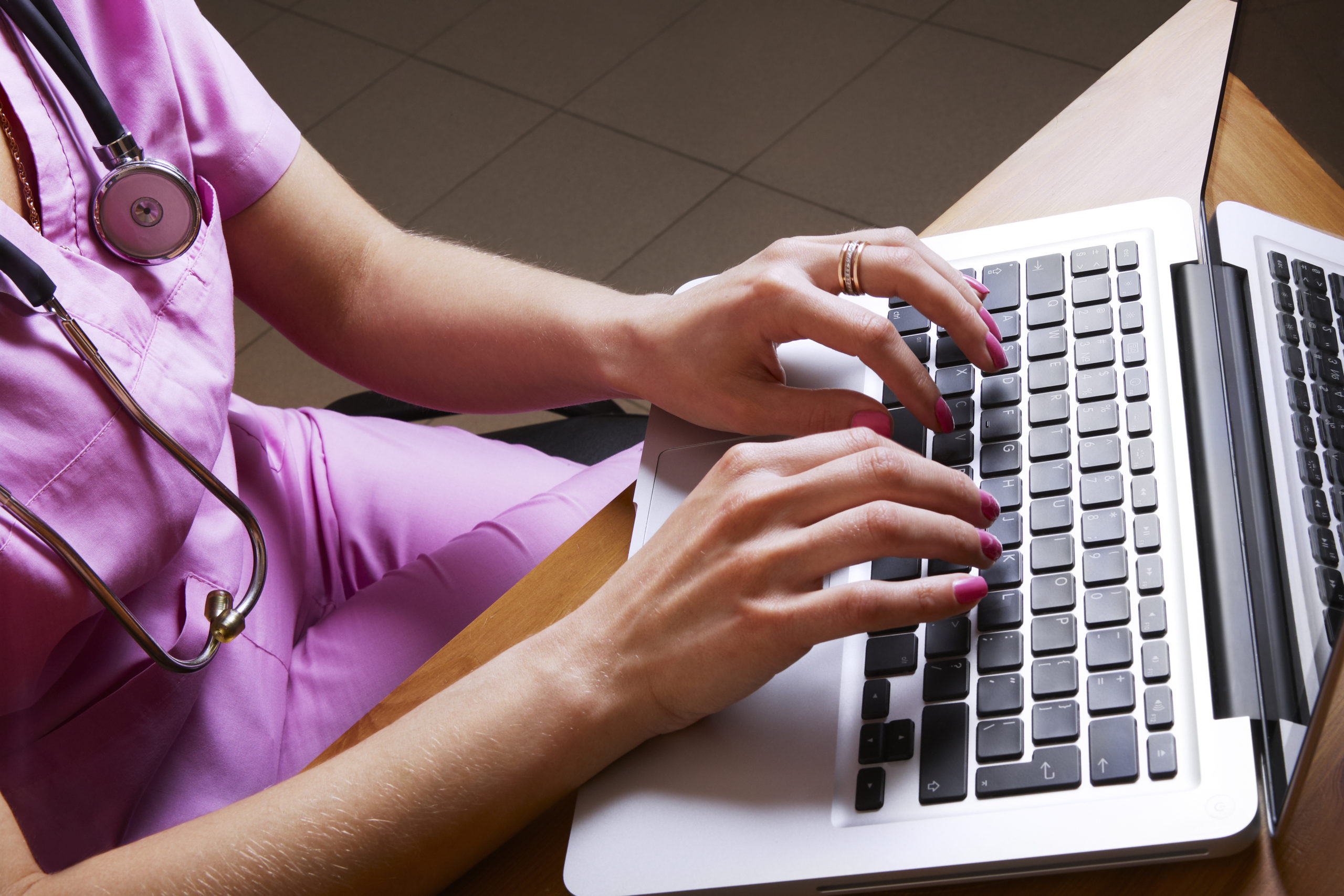 Female nurse using laptop