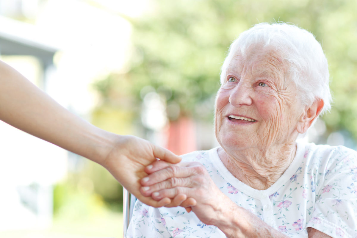 image of senior woman taking someone's hand for BHS frailty webinar