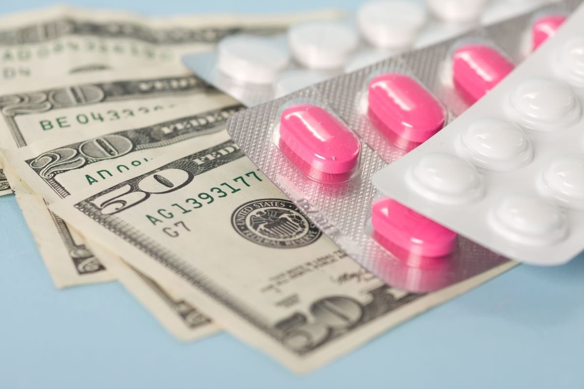 image of money and medications for webinar on inflation reduction act and drug pricing reform