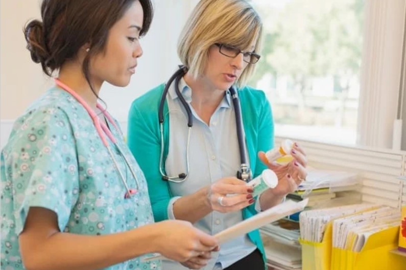 female health care workers dispensing medications