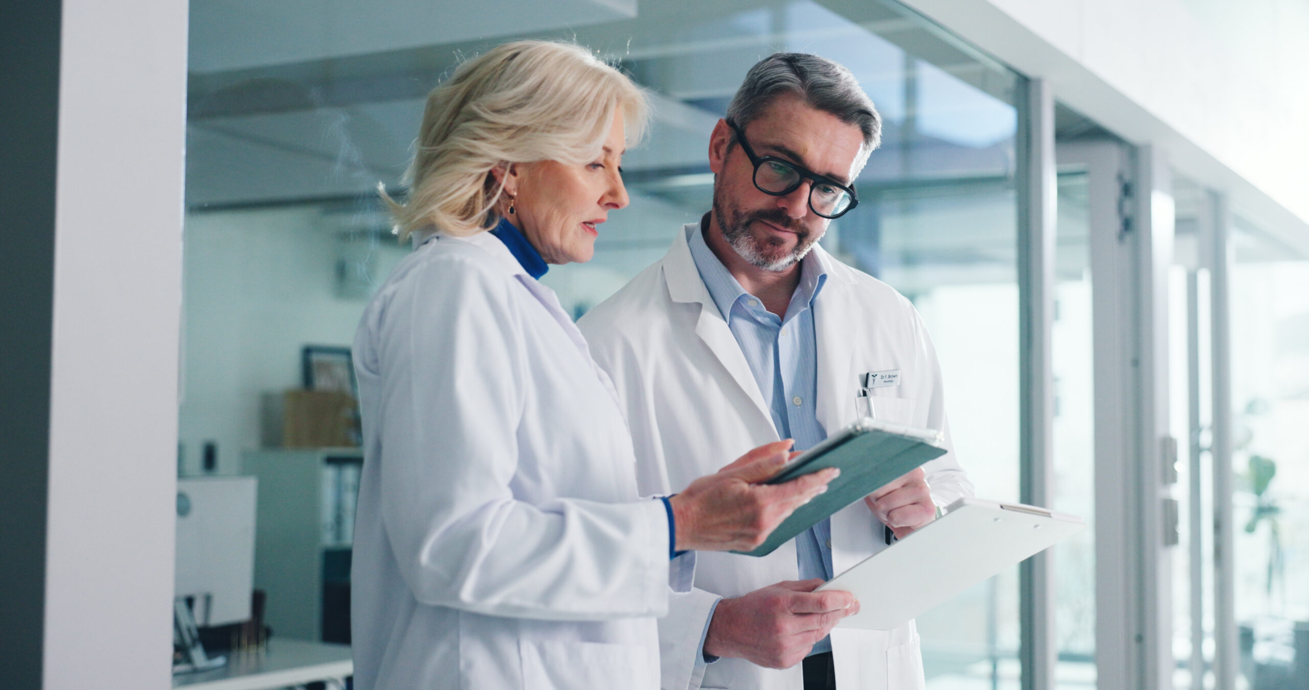 health care professionals looking at tablet