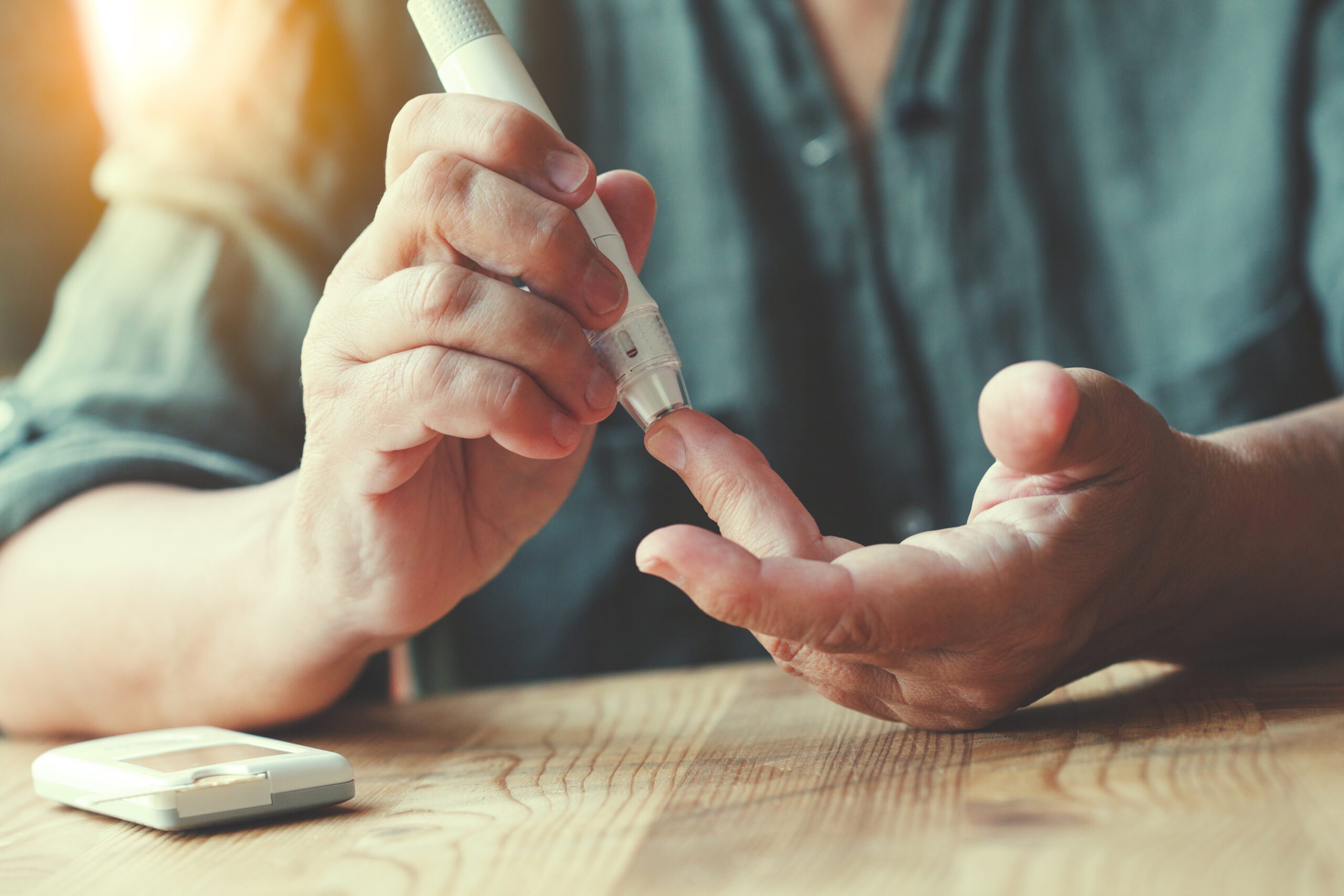 person testing glucose