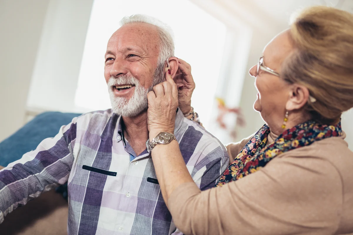 elderly man receiving hearing loss treatment