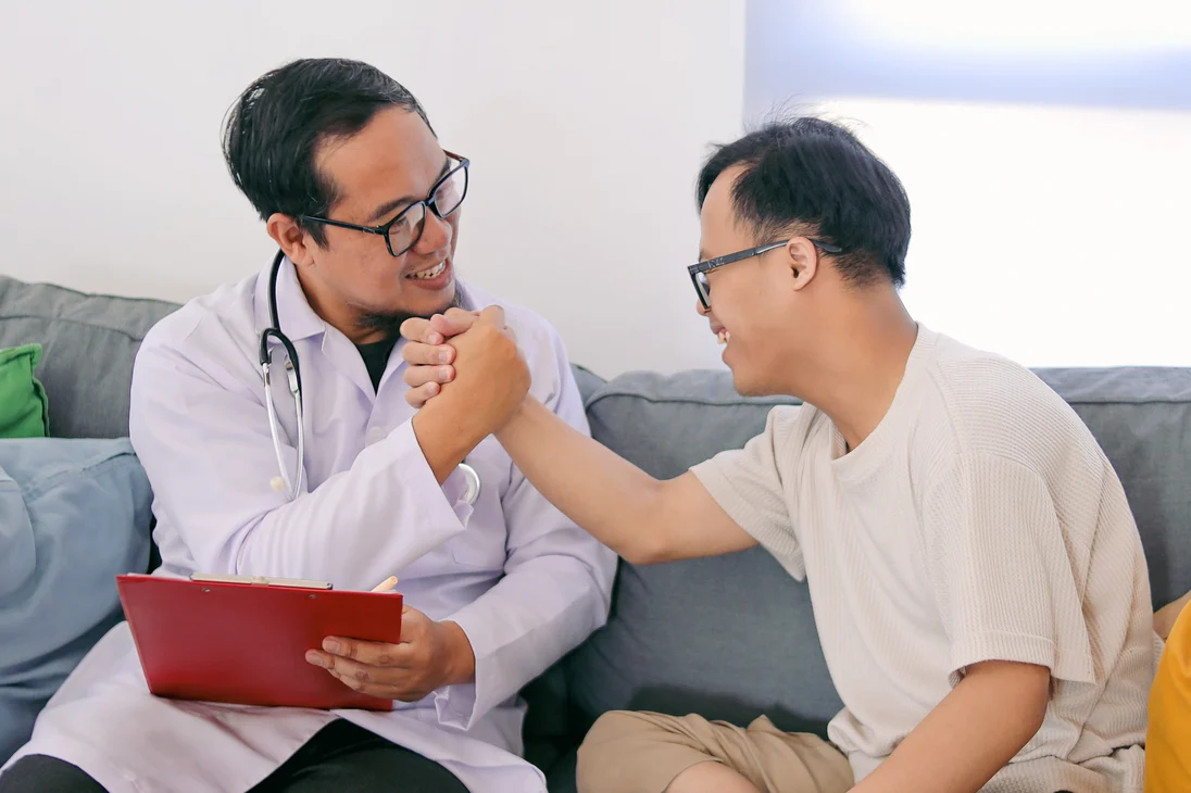 I/DD patient sitting with physician